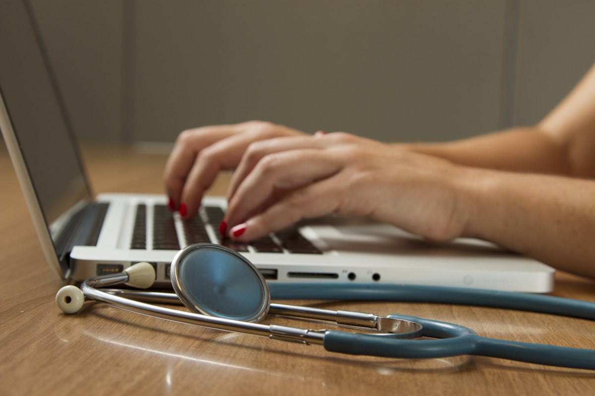 Credentialing specialist assembling payer enrollment files